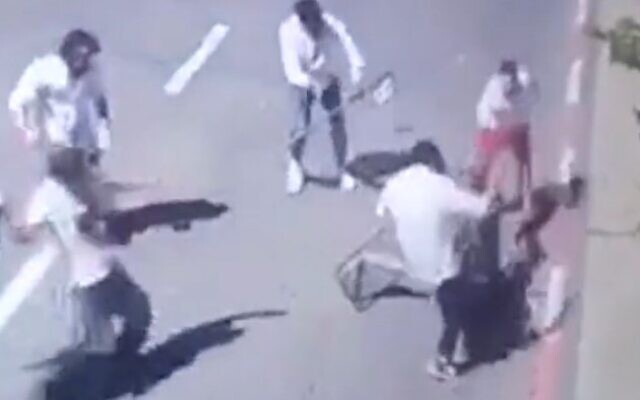 Jewish worshipers attack a Druze guard at the Meron shrine in northern Israel on May 6, 2023. (Screencapture/Twitter used in accordance with Clause 27a of the Copyright Law)
