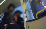 Screen capture from video of ultra-Orthodox men preventing a woman from boarding a bus in Ashdod due to her gender, May 7, 2023. (Channel 12. Used in accordance with Clause 27a of the Copyright Law)