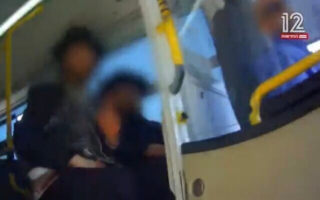 Screen capture from video of ultra-Orthodox men preventing a woman from boarding a bus in Ashdod due to her gender, May 7, 2023. (Channel 12. Used in accordance with Clause 27a of the Copyright Law) Screen capture from video of ultra-Orthodox men preventing a woman from boarding a bus in Ashdod due to her gender, May 7, 2023. (Channel 12. Used in accordance with Clause 27a of the Copyright Law)