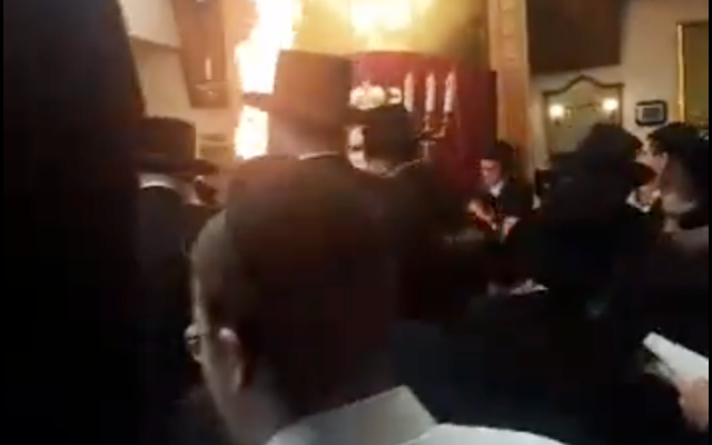 The bonfire lit inside Beis Midrash Beis Shmuel synagogue in London, England last week (Screenshot via Jewish News UK used in accordance with Clause 27a of the Copyright Law). The bonfire lit inside Beis Midrash Beis Shmuel synagogue in London, England last week (Screenshot via Jewish News UK used in accordance with Clause 27a of the Copyright Law).