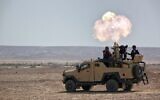 An Elbit mortar munition system anchored on a military vehicle. (Elbit)