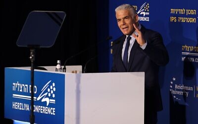 Opposition leader and Yesh Atid chairman MK Yair Lapid speaks at the Herzliya Conference at Reichman University, May 23, 2023. (Gilad Kavalerchik)