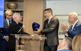 Dr. Anthony Fauci, former director of the National Institute of Allergy and Infectious Diseases at the National Institutes of Health (left), receives the Champion of Global Human Health Award from Professor Yitshak Kreiss, director general of Sheba Medical Center, Washington, April 30, 2023. (Ron Sachs/CNP)