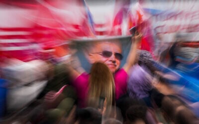 Supporters of President Recep Tayyip Erdogan celebrate outside his residence in Istanbul, Turkey, May 28, 2023. (AP Photo/ Francisco Seco)