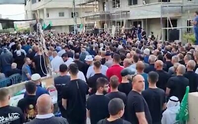 Mourners attend the funeral for Diar Umari, 19, on May 7, 2023. Umari, from the northern Arab village of Sandala, was shot dead in a road clash a day prior. (Twitter/Kan, used in accordance with Clause 27a of the Copyright Law)