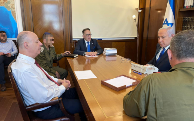 Prime Minister Benjamin Netanyahu, right, holds a situation assessment with National Security Adviser Tzachi Hanegbi, left, Chief of Staff Tzachi Braverman, and Military Secretary Avi Gil at the Prime Minister's Office in Jerusalem on May 11, 2023 (Courtesy) Prime Minister Benjamin Netanyahu, right, holds a situation assessment with National Security Adviser Tzachi Hanegbi, left, Chief of Staff Tzachi Braverman, and Military Secretary Avi Gil at the Prime Minister's Office in Jerusalem on May 11, 2023 (Courtesy)