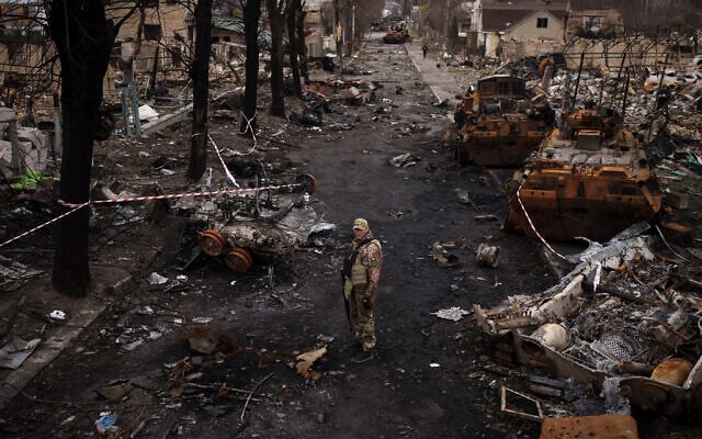A Ukrainian serviceman stands amid destroyed Russian tanks in Bucha, on the outskirts of Kyiv, Ukraine, April 6, 2022. (AP Photo/Felipe Dana, File) A Ukrainian serviceman stands amid destroyed Russian tanks in Bucha, on the outskirts of Kyiv, Ukraine, April 6, 2022. (AP Photo/Felipe Dana, File)