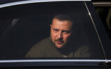 Ukraine's President Volodymyr Zelensky is seen in a car during a visit at a military airbase in Soesterberg, Netherlands, May 4, 2023. (Yves Herman/Pool via AP)