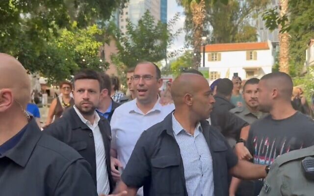 Religious Zionism MK Simcha Rothman leaving the Hebrew Book Week Fair amid anti-judicial overhaul protests at Sarona Market, Tel Aviv, June 18, 2023. (Twitter video screenshot: used in accordance with Clause 27a of the Copyright Law) Religious Zionism MK Simcha Rothman leaving the Hebrew Book Week Fair amid anti-judicial overhaul protests at Sarona Market, Tel Aviv, June 18, 2023. (Twitter video screenshot: used in accordance with Clause 27a of the Copyright Law)