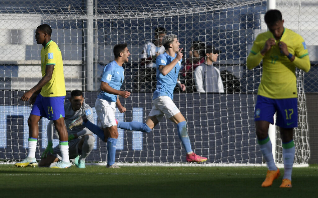 Israel's forward Dor Turgeman (2-R) celebrates after scoring his team's third goal during extra time of the Argentina 2023 U-20 World Cup quarterfinal soccer match between Israel and Brazil, at the San Juan del Bicentenario stadium in San Juan, Argentina, on June 3, 2023. (Andres Larrovere/AFP)