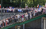 People attend an anti-government demonstration organized by the opposition in Warsaw on June 4, 2023. (Wojtek Radwanski / AFP)