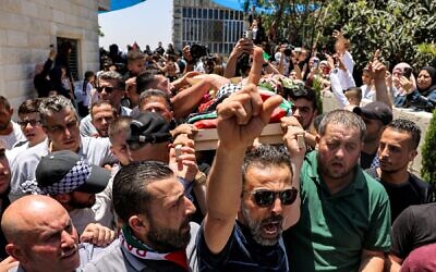 Mourners carry the body of 2.5-year-old Mohammed Haitham al-Tamimi during his funeral in the village of Nabi Saleh in the West Bank, June 6, 2023. (AHMAD GHARABLI / AFP)
