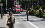 French police officers stand next to an emergency truck following a mass stabbing in Annecy, central-eastern France on June 8, 2023. (OLIVIER CHASSIGNOLE/AFP)