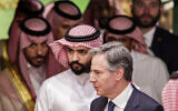 US Secretary of State Antony Blinken (front) walks, during a joint press conference with the Saudi foreign minister (not pictured) after a ministerial meeting of the Global Coalition to Defeat the Islamic State in Riyadh on June 8, 2023. (Ahmed Yosri/Pool/AFP)