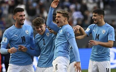 Illustrative: Israel's forward Omer Senior, center, celebrates with teammates after scoring a goal during the Argentina 2023 U-20 World Cup third-place match between Israel and South Korea at the Estadio Unico Diego Armando Maradona stadium in La Plata, Argentina, on June 11, 2023. (Luis ROBAYO / AFP)