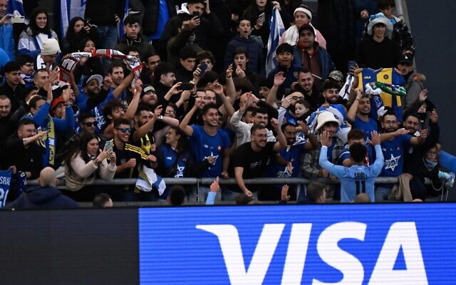 Israel's forward Hamza Shibli celebrates with fans after defeating South Korea and achieving the third place in the Argentina 2023 U-20 World Cup at the Estadio Unico Diego Armando Maradona stadium in La Plata, Argentina, on June 11, 2023. (Luis ROBAYO / AFP)