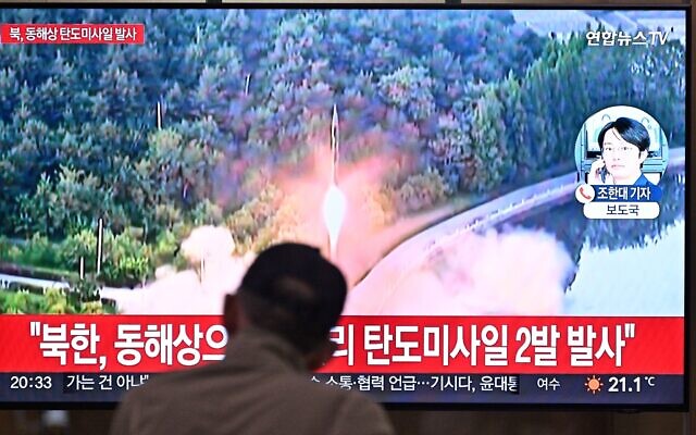 A man watches a television showing a news broadcast with file footage of a North Korean missile test, at a railway station in Seoul on June 15, 2023. (Photo by Anthony WALLACE / AFP) A man watches a television showing a news broadcast with file footage of a North Korean missile test, at a railway station in Seoul on June 15, 2023. (Photo by Anthony WALLACE / AFP)