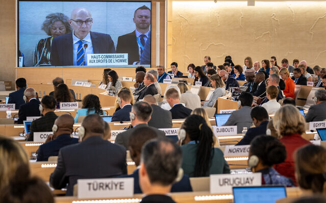 UN High Commissioner for Human Rights Volker Turk (C) is seen on a giant screen as he delivers a speech at the opening of the 53rd UN Human Rights Council in Geneva, on June 19, 2023. (Photo by Fabrice COFFRINI / AFP) UN High Commissioner for Human Rights Volker Turk (C) is seen on a giant screen as he delivers a speech at the opening of the 53rd UN Human Rights Council in Geneva, on June 19, 2023. (Photo by Fabrice COFFRINI / AFP)