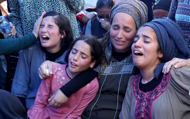 Relatives and friends mourn during the funeral of 17-year-old Nachman Mordoff, who was killed in a terror attack near the West Bank settlement of Eli, at the cemetery in Shilo, on June 21, 2023. (Photo by Menahem KAHANA / AFP) Relatives and friends mourn during the funeral of 17-year-old Nachman Mordoff, who was killed in a terror attack near the West Bank settlement of Eli, at the cemetery in Shilo, on June 21, 2023. (Photo by Menahem KAHANA / AFP)