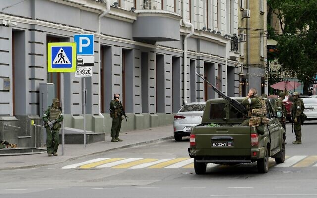 Members of the mercenary Wagner Group stand guard in a street in the Russian city of Rostov-on-Don, on June 24, 2023. (Stringer/AFP) Members of the mercenary Wagner Group stand guard in a street in the Russian city of Rostov-on-Don, on June 24, 2023. (Stringer/AFP)