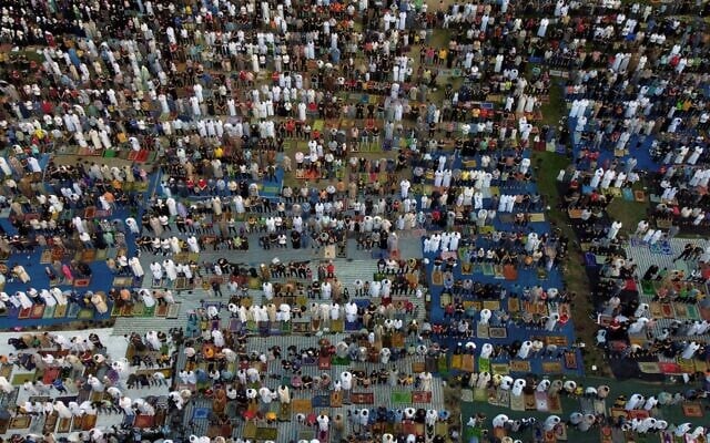 This aerial view shows Muslim worshippers gathering in Gaza City to perform Eid Al-Adha morning prayers, on June 28, 2023. (MOHAMMED ABED / AFP)