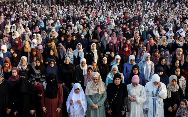 Palestinian female Muslim worshippers perform Eid Al-Adha morning prayers, on June 28, 2023 in Gaza City. (MOHAMMED ABED / AFP)