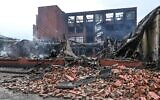 This general view shows the fire destroyed Tessi group building in the Alma district of Roubaix, northern France on June 30, 2023, following riots three days after a 17-year-old boy was shot dead by police. (Denis Charlet/AFP)