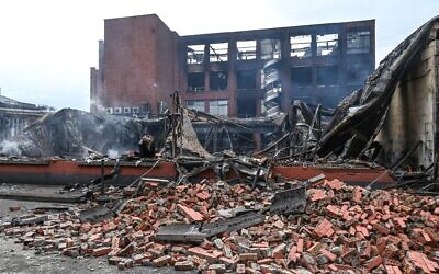 This general view shows the fire destroyed Tessi group building in the Alma district of Roubaix, northern France on June 30, 2023, following riots three days after a 17-year-old boy was shot dead by police. (Denis Charlet/AFP)