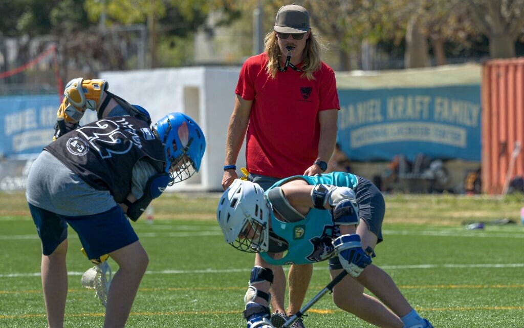 Yakov Silberlicht, in the red shirt, is the director of youth development for Israel Lacrosse. (Courtesy of the Israel Lacrosse Association via JTA)
