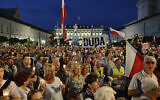 File: Protesters shout slogans as they gather in front of the Presidential Palace to show President Andrzej Duda their disapproval after he signed controversial legislation on the Supreme Court into law, in Warsaw, Poland, July 26, 2018. (AP Photo/Alik Keplicz)