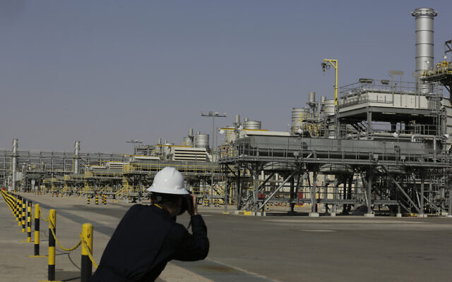 A photographer takes pictures of the Khurais oil field during a tour for journalists, 150 km east-northeast of Riyadh, Saudi Arabia, June 28, 2021. (AP/Amr Nabil) A photographer takes pictures of the Khurais oil field during a tour for journalists, 150 km east-northeast of Riyadh, Saudi Arabia, June 28, 2021. (AP/Amr Nabil)