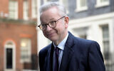 Michael Gove, Britain's Secretary of State for Levelling Up, Housing and Communities; Minister for Intergovernmental Relations, leaves after attending a cabinet meeting in Downing Street in London, January 17, 2023. (AP/Kirsty Wigglesworth)