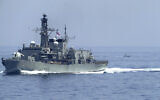 The British frigate HMS Lancaster sails as Iranian Revolutionary Guard vessels follow behind it in the Strait of Hormuz Friday, May 19, 2023. (AP/Jon Gambrell)