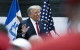 Former US president Donald Trump visits with campaign volunteers at the Grimes Community Complex Park, June 1, 2023, in Des Moines, Iowa. (Charlie Neibergall/AP)