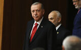 Turkish President Recep Tayyip Erdogan joins legislators elected to the Grand National Assembly of Turkey in the May 14 parliamentary elections and attend their first parliamentary session to take the oath, in Ankara, Turkey, June 2, 2023. (AP Photo/Ali Unal)