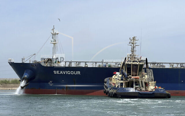 A tugboat pushes the Seavigour, after it suffered a mechanical malfunction in the Suez Canal, Egypt, June 4, 2023. (Suez Canal Authority via AP) A tugboat pushes the Seavigour, after it suffered a mechanical malfunction in the Suez Canal, Egypt, June 4, 2023. (Suez Canal Authority via AP)