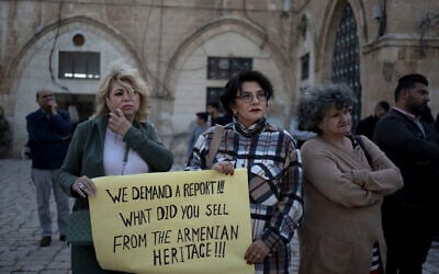 Members of the Armenian community protest a contentious deal to hand over a large section of the Armenian Quarter in the Old City of Jerusalem for a hotel project, May 19, 2023. (Maya Alleruzzo/AP)