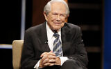 Rev. Pat Robertson poses a question to a Republican presidential candidate during a forum at Regent University in Virginia Beach, Virginia, Oct. 23, 2015.  (AP Photo/Steve Helber, File)