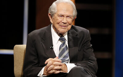 Rev. Pat Robertson poses a question to a Republican presidential candidate during a forum at Regent University in Virginia Beach, Virginia, Oct. 23, 2015.  (AP Photo/Steve Helber, File)