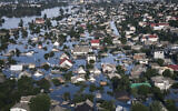 Streets are flooded in Kherson, Ukraine, June 7, 2023, after the Kakhovka dam was blown up. (AP Photo/Libkos)