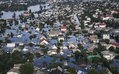 Streets are flooded in Kherson, Ukraine, June 7, 2023, after the Kakhovka dam was blown up. (AP Photo/Libkos)