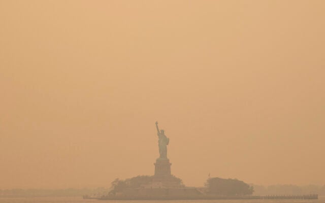 The Statue of Liberty, covered in a haze-filled sky, is photographed from the Staten Island Ferry, Wednesday, June 7, 2023, in New York. (AP Photo/Yuki Iwamura) The Statue of Liberty, covered in a haze-filled sky, is photographed from the Staten Island Ferry, Wednesday, June 7, 2023, in New York. (AP Photo/Yuki Iwamura)