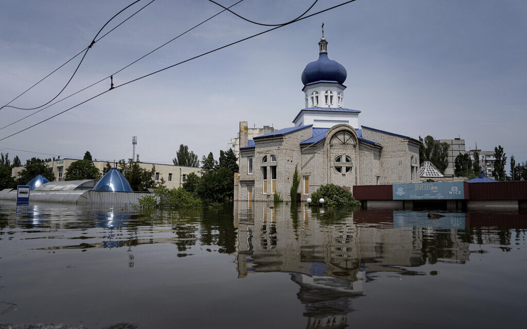 A church surrounded by water in a flooded neighborhood in Kherson, Ukraine, June 8, 2023. (Evgeniy Maloletka/AP)