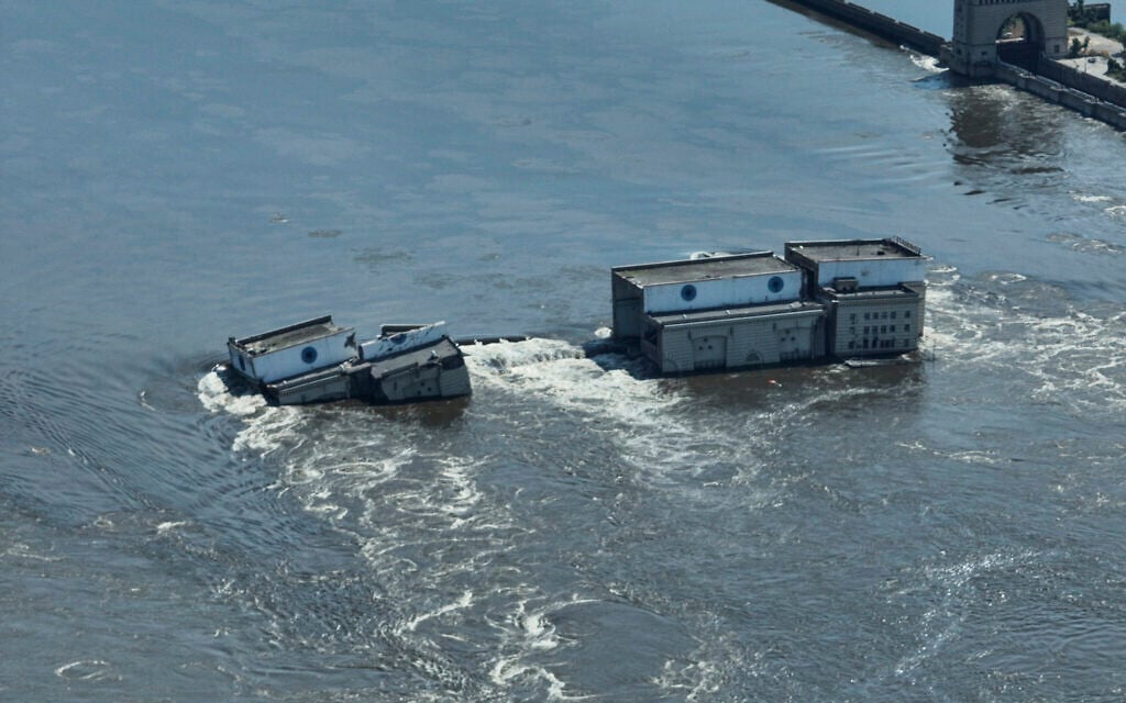 Water flows over the collapsed Kakhovka dam in Nova Kakhovka, in Russian-occupied Ukraine, June 7, 2023. (AP Photo)