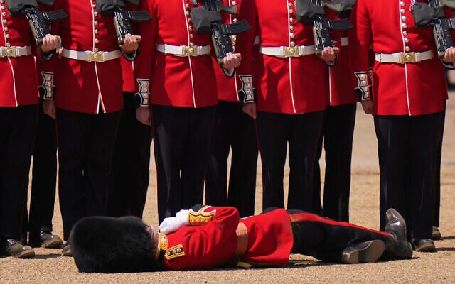 A soldier faints during the Colonel's Review, the final rehearsal of the Trooping the Colour, the King's annual birthday parade, at Horse Guards Parade in London, June 10, 2023. (AP Photo/Alberto Pezzali) A soldier faints during the Colonel's Review, the final rehearsal of the Trooping the Colour, the King's annual birthday parade, at Horse Guards Parade in London, June 10, 2023. (AP Photo/Alberto Pezzali)