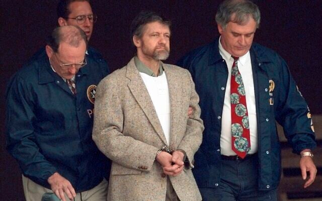 Theodore Kaczynski looks around as US Marshals prepare to take him down the steps at the federal courthouse to a waiting vehicle on June 21, 1996, in Helena, Montana. (Elaine Thompson/AP) Theodore Kaczynski looks around as US Marshals prepare to take him down the steps at the federal courthouse to a waiting vehicle on June 21, 1996, in Helena, Montana. (Elaine Thompson/AP)