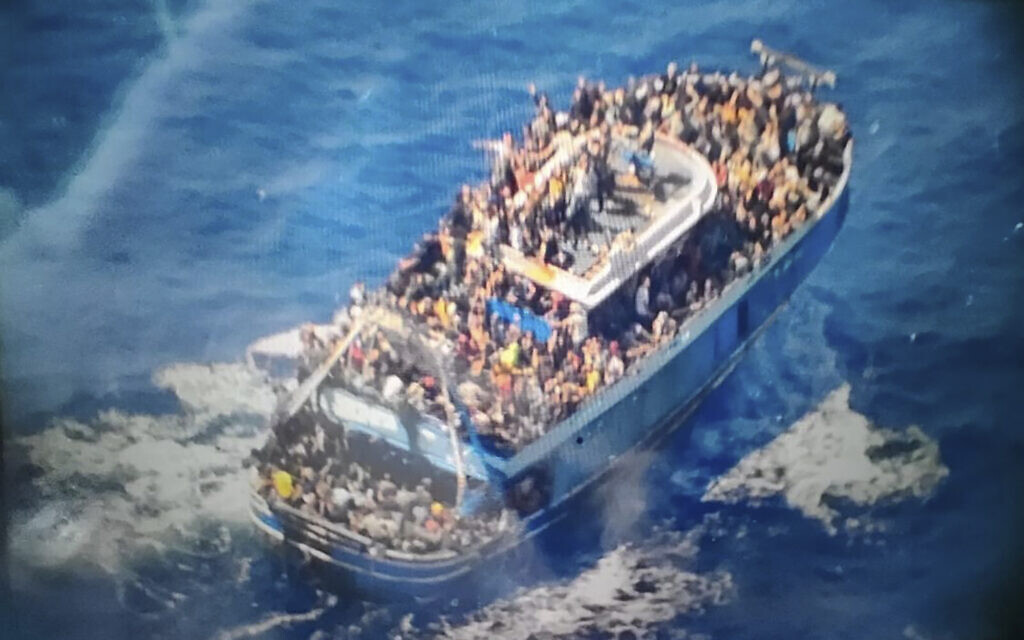 This undated handout image provided by Greece's coast guard on Wednesday, June 14, 2023, shows scores of people covering practically every free stretch of deck on a battered fishing boat that later capsized and sank off southern Greece. (Hellenic Coast Guard via AP) This undated handout image provided by Greece's coast guard on Wednesday, June 14, 2023, shows scores of people covering practically every free stretch of deck on a battered fishing boat that later capsized and sank off southern Greece. (Hellenic Coast Guard via AP)