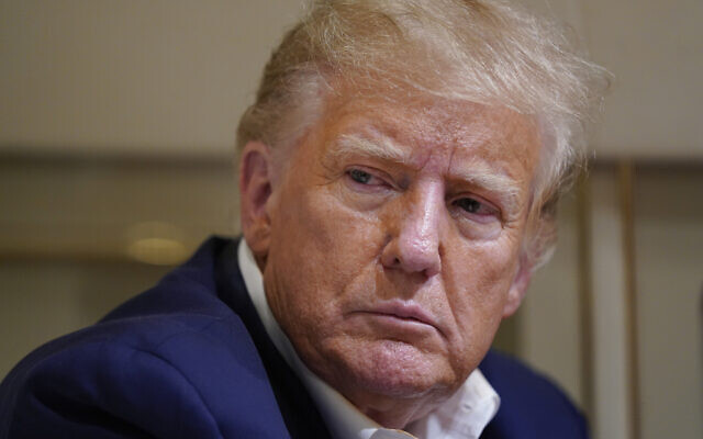 Former US President Donald Trump listens as he speaks with reporters while in flight on his plane after a campaign rally at Waco Regional Airport, in Waco, Texas, Saturday, March 25, 2023. (AP Photo/Evan Vucci, File) Former US President Donald Trump listens as he speaks with reporters while in flight on his plane after a campaign rally at Waco Regional Airport, in Waco, Texas, Saturday, March 25, 2023. (AP Photo/Evan Vucci, File)