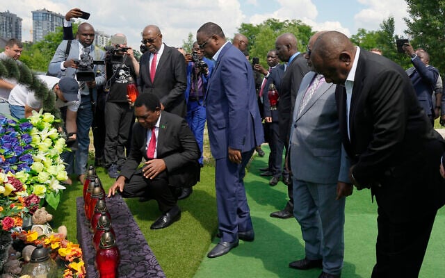 From right, South African President Cyril Ramaphosa, President of the Union of Comoros Azali Assoumani, Senegal's President Macky Sall, and Zambia's President Hakainde Hichilema, bottom, attend a commemoration ceremony at a site of a mass grave in Bucha, on the outskirts of Kyiv, Ukraine, Friday, June 16, 2023. (AP Photo/Efrem Lukatsky) From right, South African President Cyril Ramaphosa, President of the Union of Comoros Azali Assoumani, Senegal's President Macky Sall, and Zambia's President Hakainde Hichilema, bottom, attend a commemoration ceremony at a site of a mass grave in Bucha, on the outskirts of Kyiv, Ukraine, Friday, June 16, 2023. (AP Photo/Efrem Lukatsky)