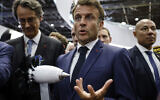 French President Emmanuel Macron gestures by a model of RISE Safran motor at the International Paris Air Show at the Paris Le Bourget airport, June 19, 2023. (Ludovic Marin, Pool via AP)